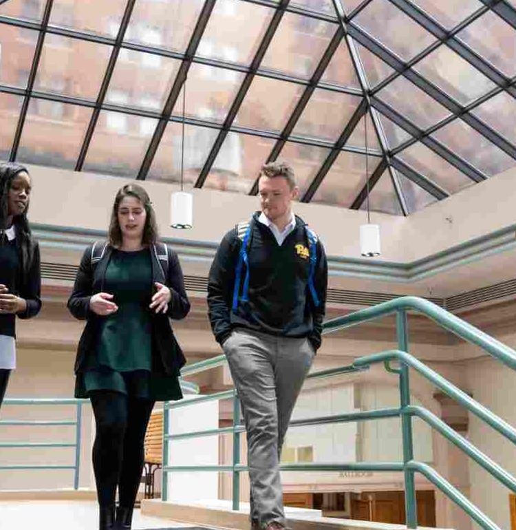 Three Students in Hallway